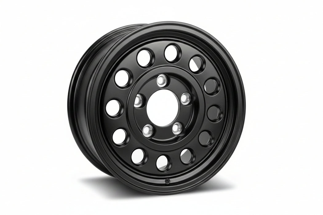 A black multi-hole steel wheel rim with a five-spoke center and a lip, shown at a three-quarter angle on a white background.