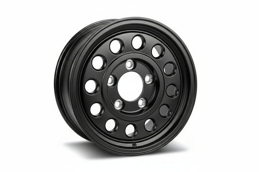 A black multi-hole steel wheel rim with a five-spoke center and a lip, shown at a three-quarter angle on a white background.