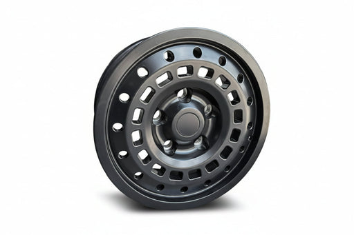 A matte black steel wheel rim with a multi-spoke, square-hole design, shown standing upright.